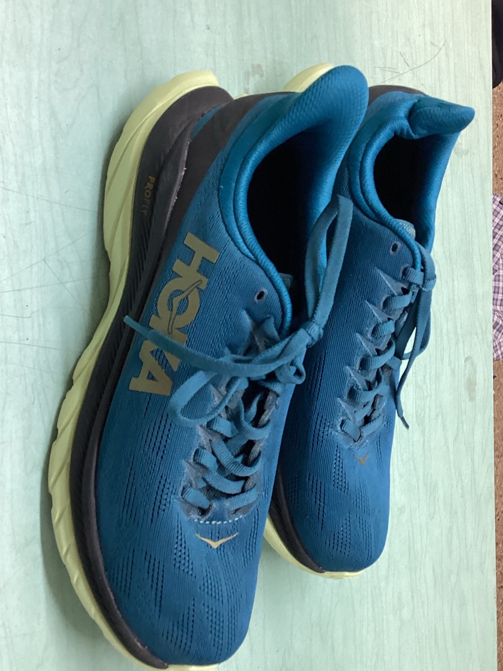 Hoka Men's Teal Athletic Running Shoes with Cream Soles